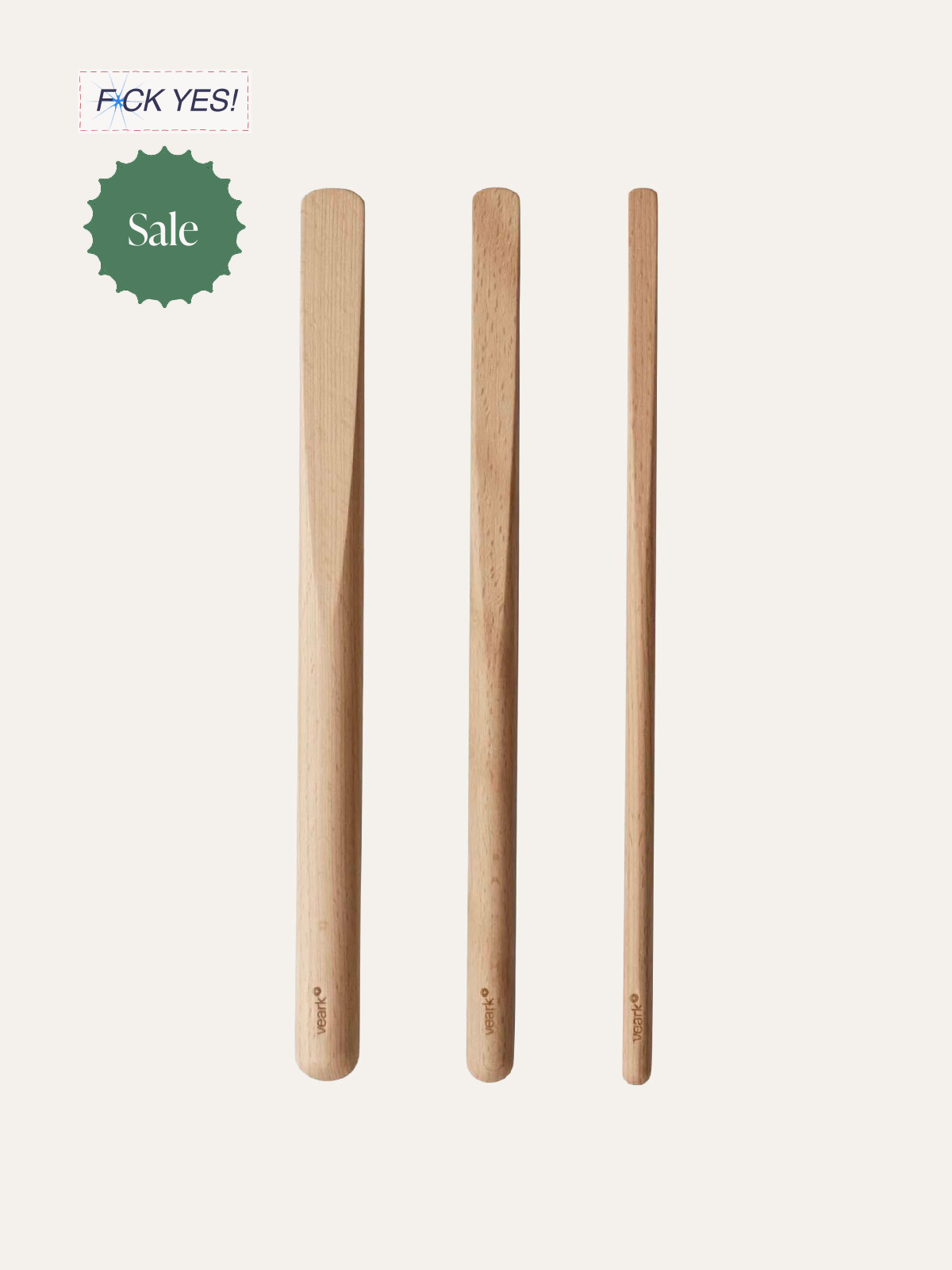 Three wooden sticks standing upright on a plain background, with text overlays including a sale tag, and a phrase with a misspelling.