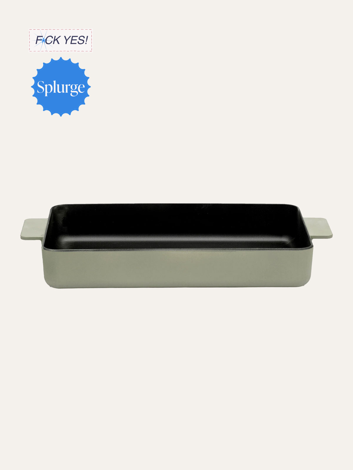 A rectangular ceramic baking dish with handles on each side, black interior, and a light-colored exterior. There are stickers in the top left corner, one with red dashed lines and the text "F**K YES!" in blue, and another with a blue background and the word "Splurge" in white.