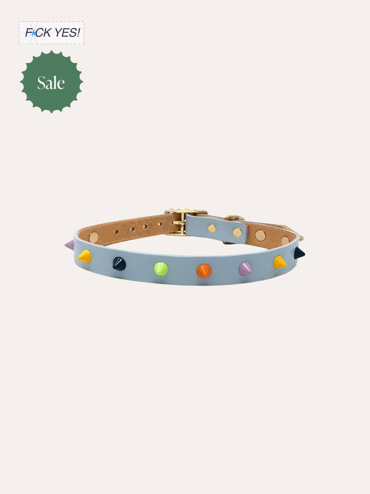 Light blue leather collar with multicolored spikes and a buckle, placed on a plain background.