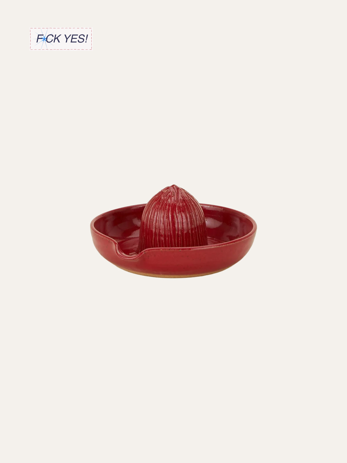 Red clay scented candle in a matching red dish.