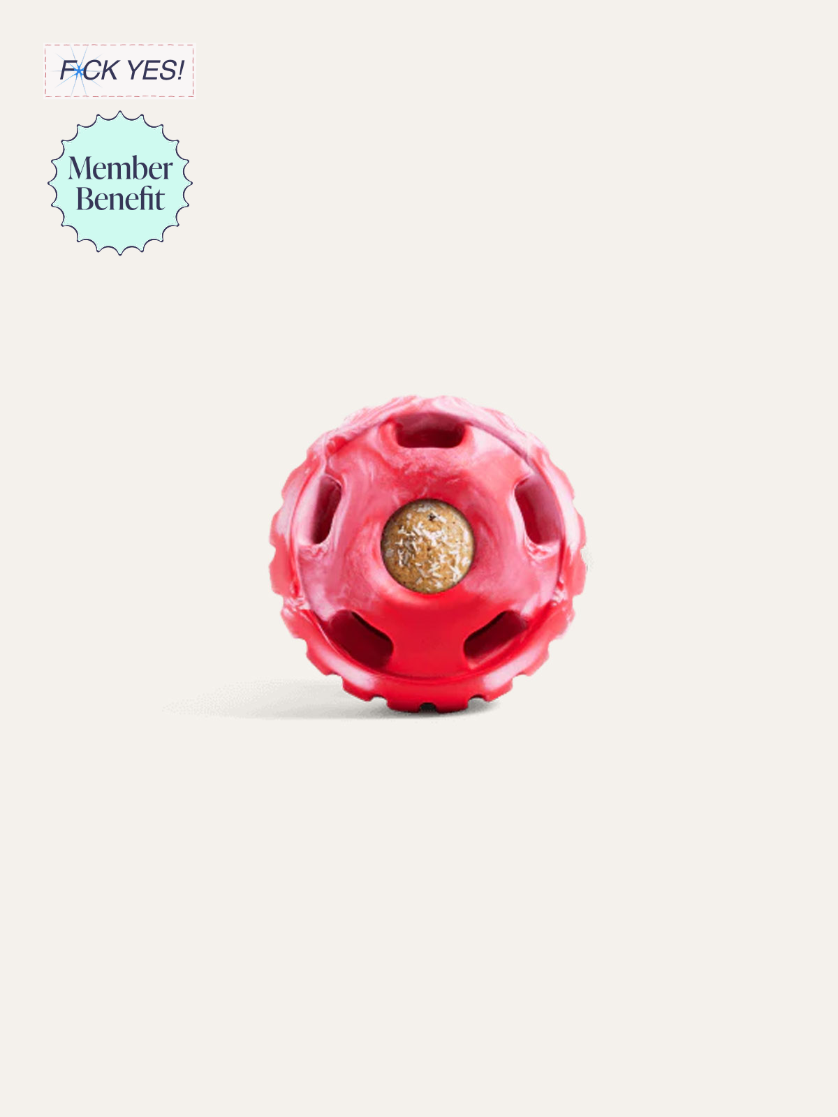 A small red ball with multiple openings and a circular cutout showing a cracker inside.