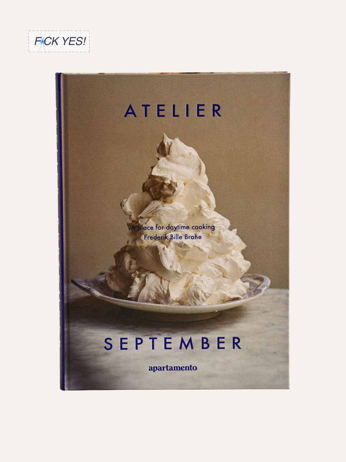 A book cover with a pile of whipped cream on a plate and the title 'Atelier September' in blue text.