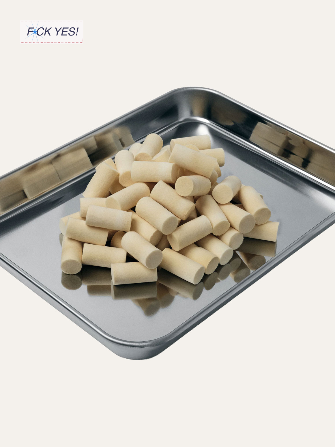 A metal tray with small white cylindrical objects, possibly white chalk or erasers, piled on it.