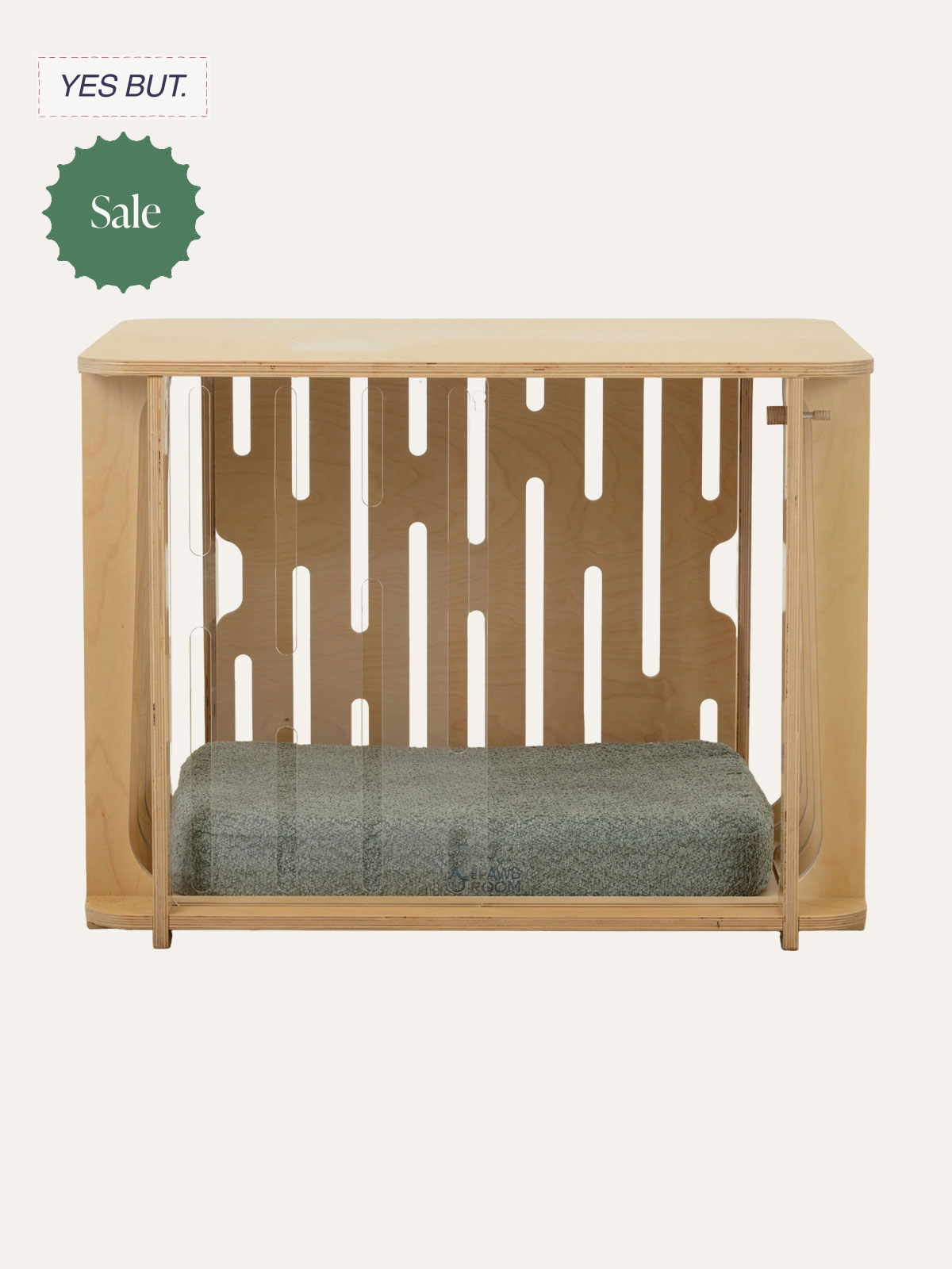 Wooden dog crate with a cushion inside and a decorative back panel.