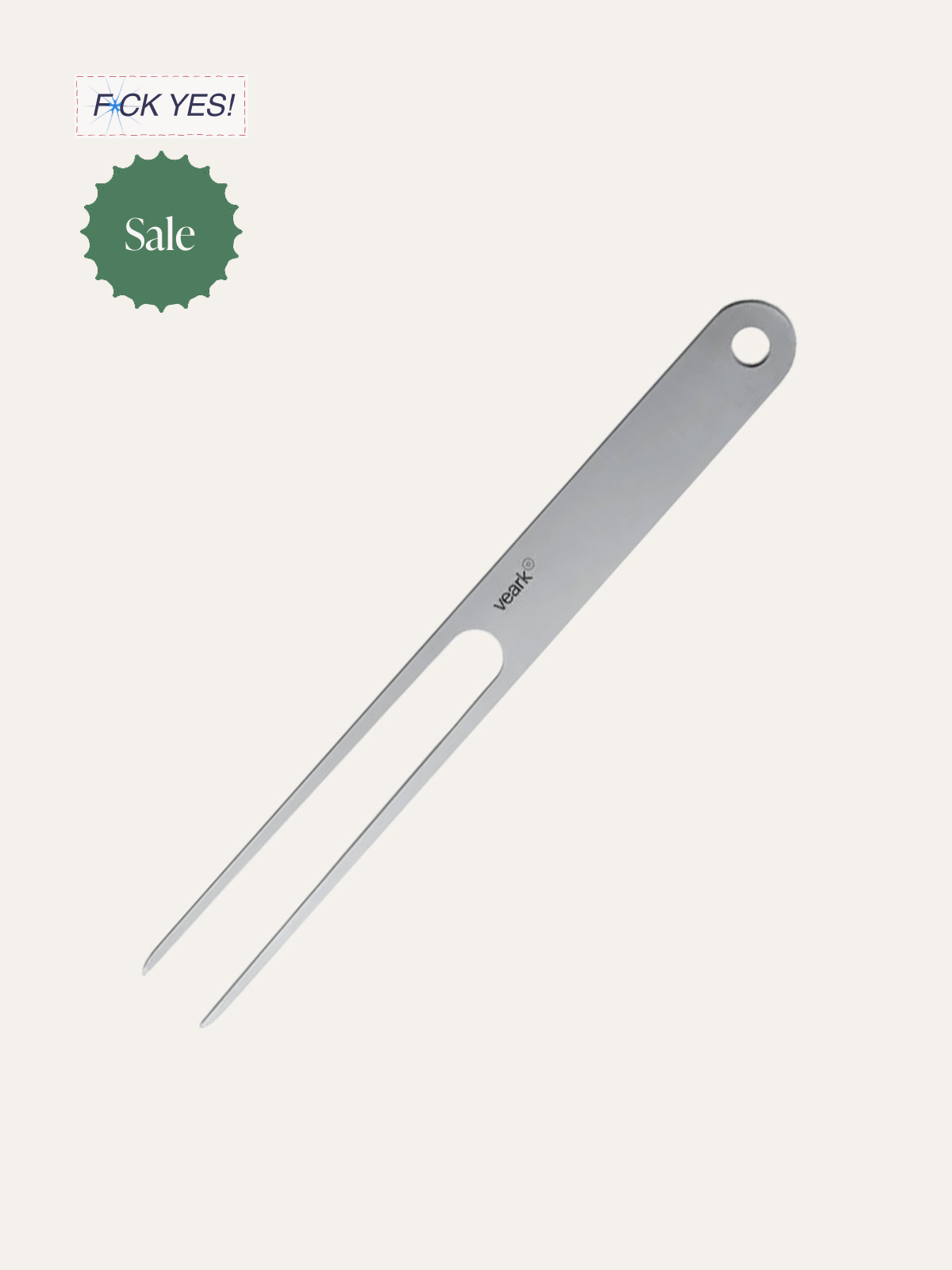 A metal hair splitting comb with two long, narrow teeth and a small circular hole at the top, labeled 'veark'.
