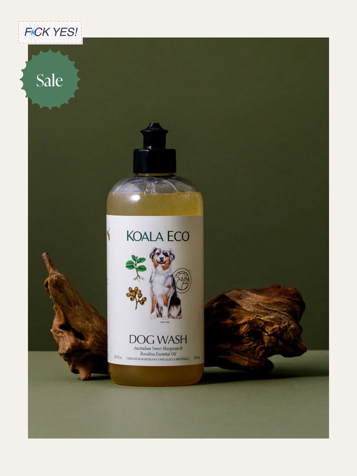 A bottle of Koala Eco dog wash on a green surface, with two pieces of wood on either side, and a green background.