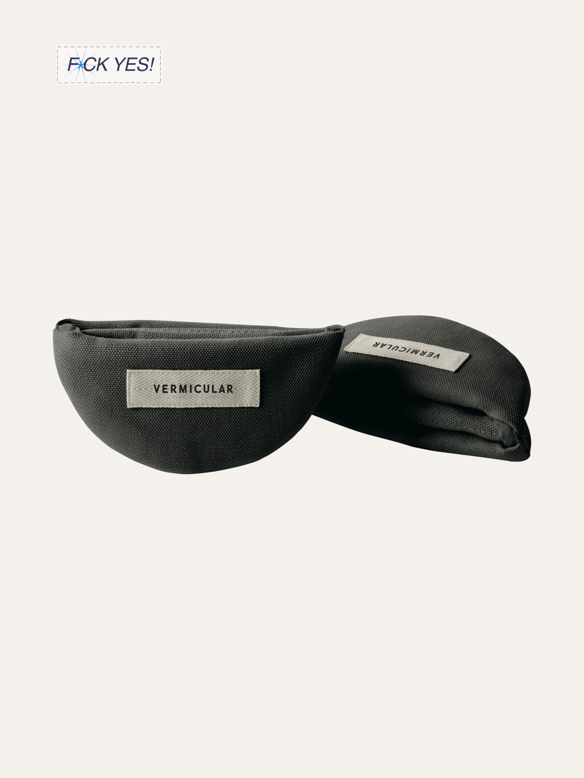 Two black ophthalmic for VERMICULAR, one open and one closed, with labels showing. The open one reveals a curved shape inside.