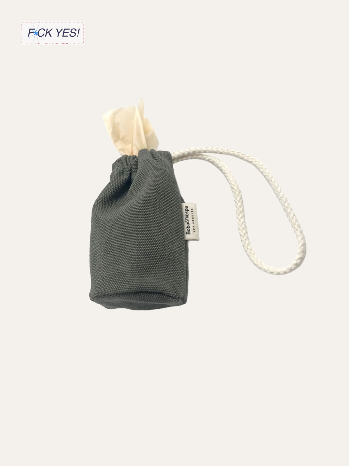 Gray fabric pouch with a white drawstring and a small tag that reads 'Bobo & Vesper', with crumpled tissue paper inside.