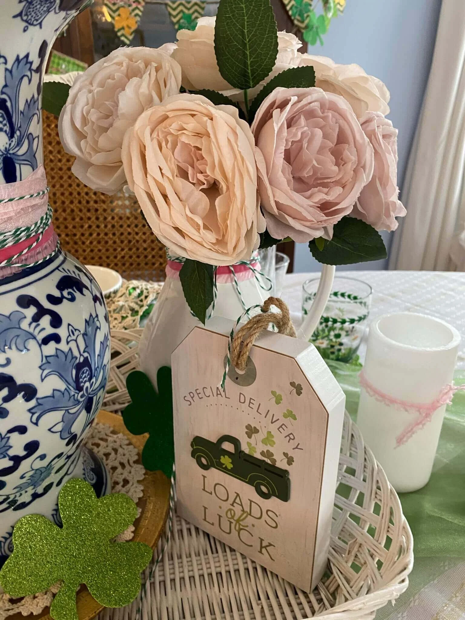 Faux peonies and St. Patrick's Day decor to create a beautiful tablescape. More classy and sophisticated decor ideas on this blog post!