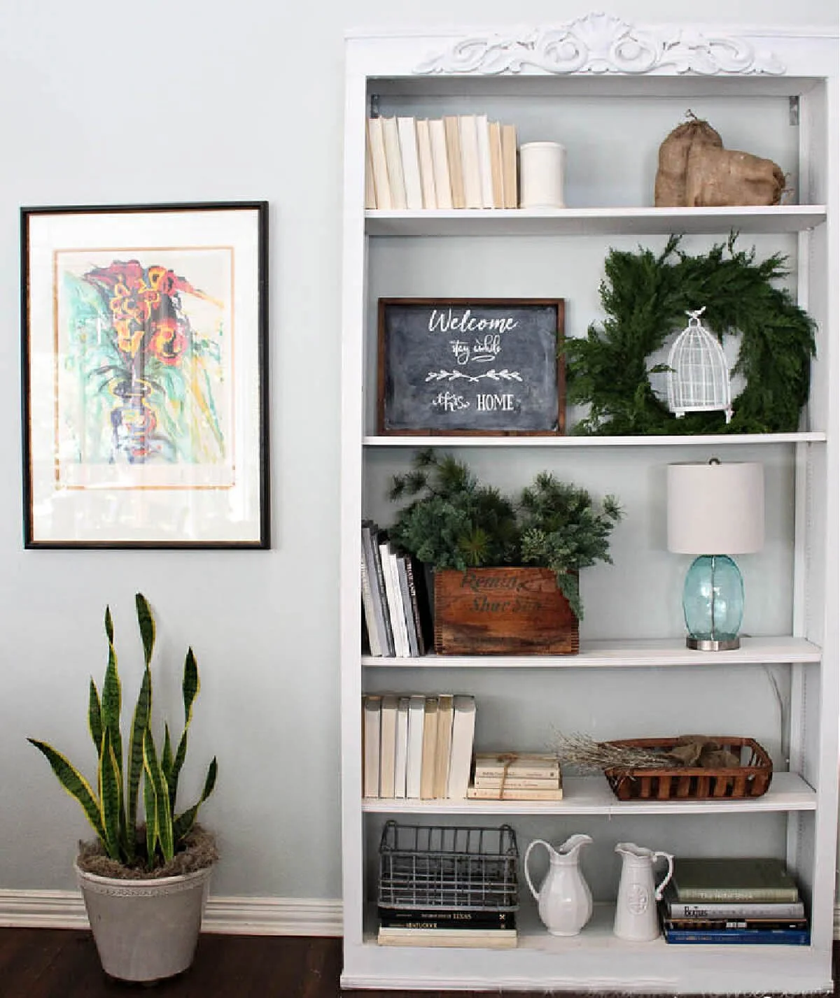 Bookshelf with books in small groupings and decorative objects
