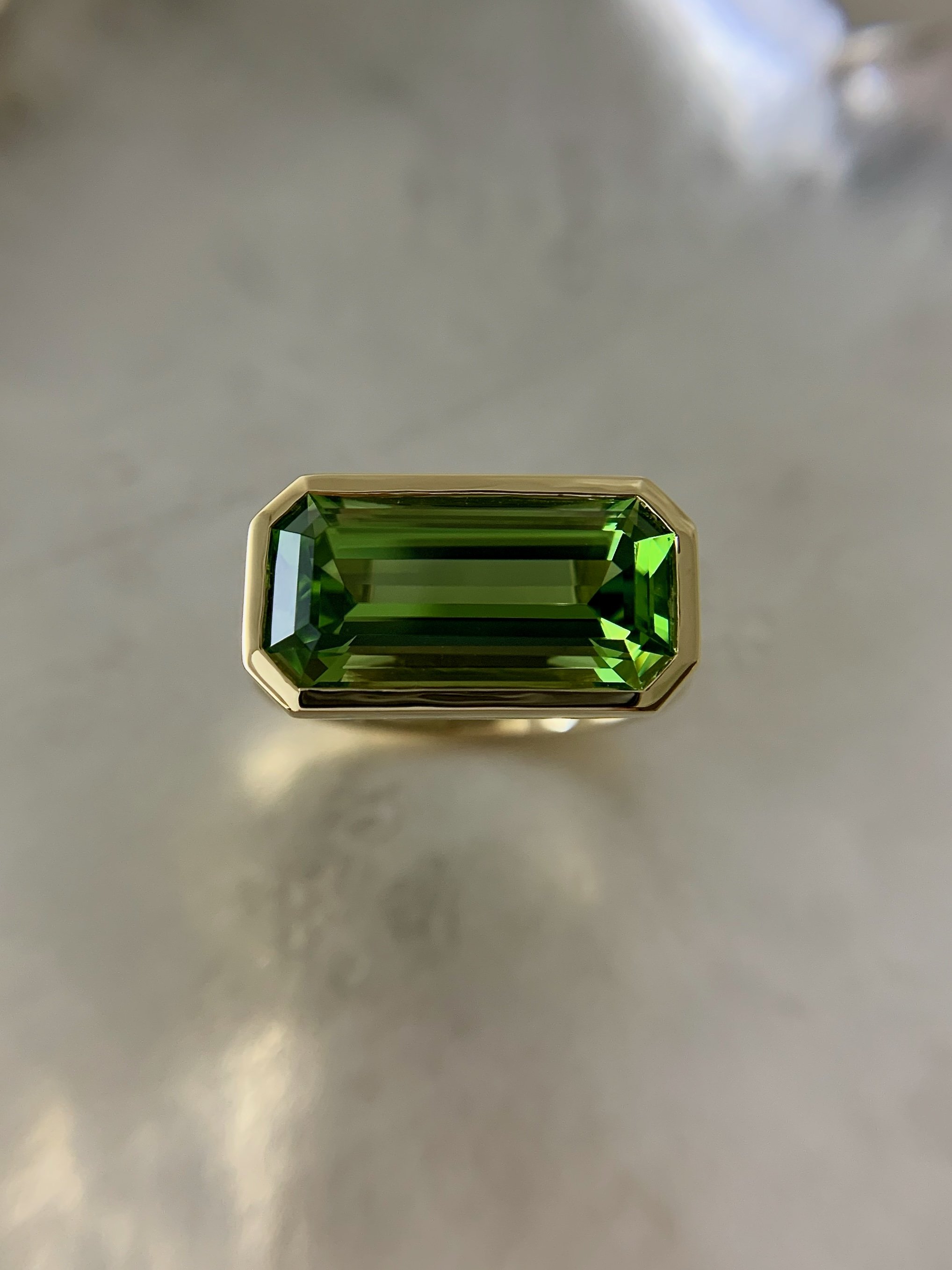 emerald-cut peridot gemstone art deco ring 18ct yellow gold