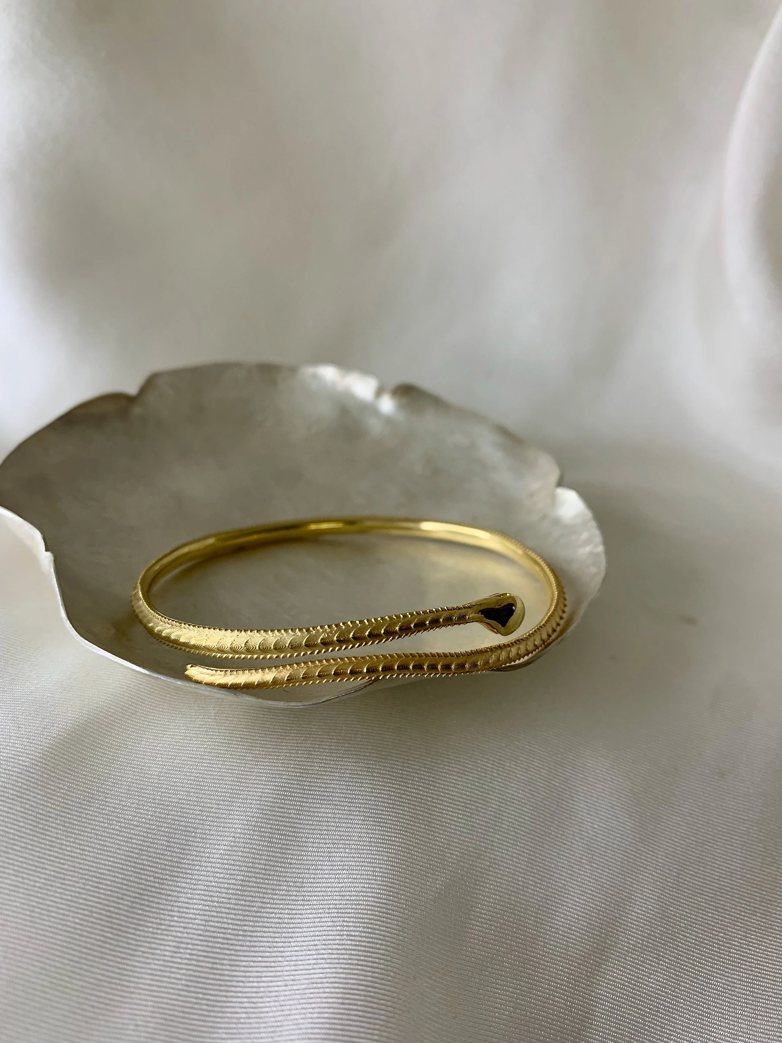 fine snake bangle in gold