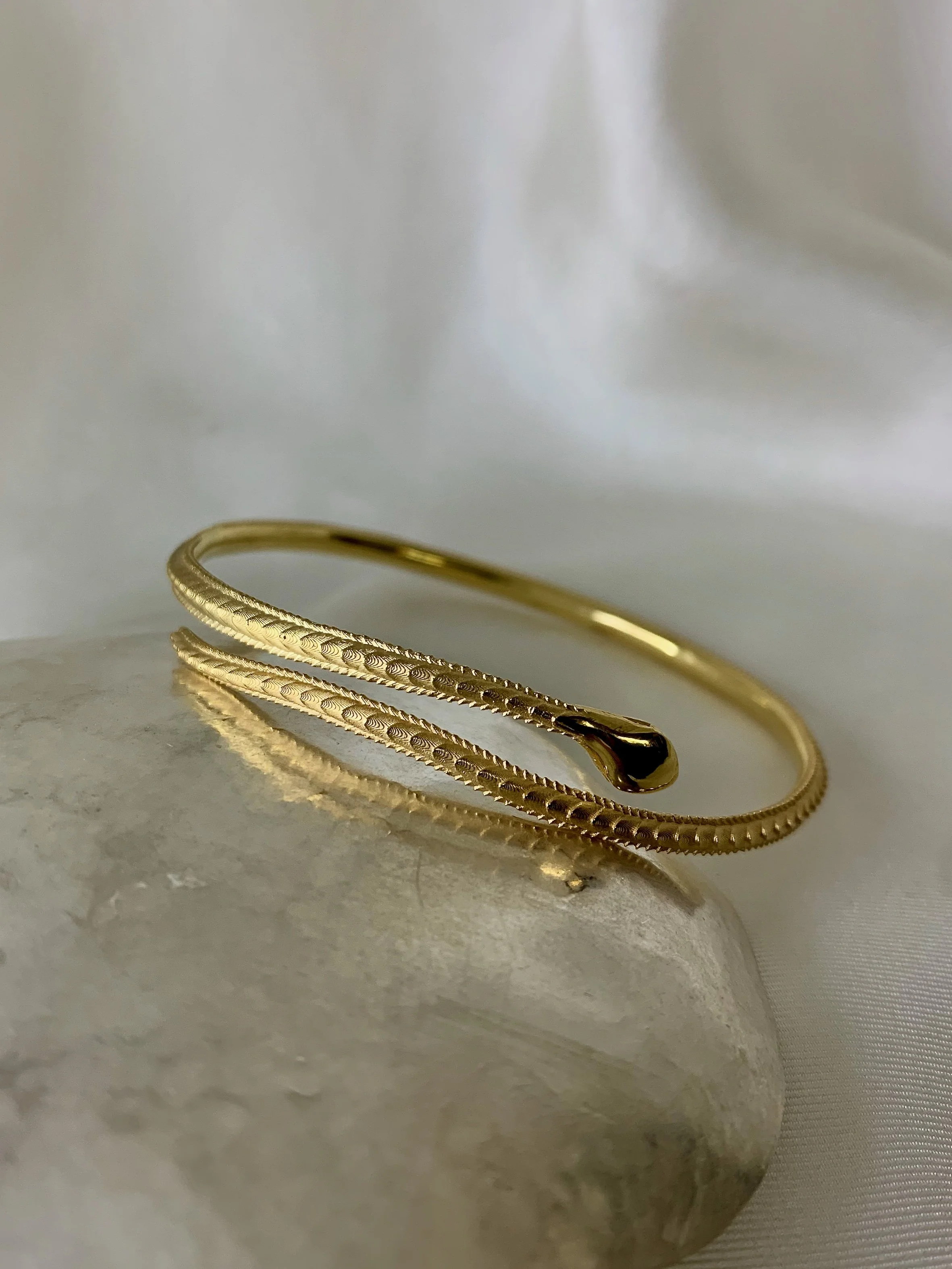 fine snake bangle in gold