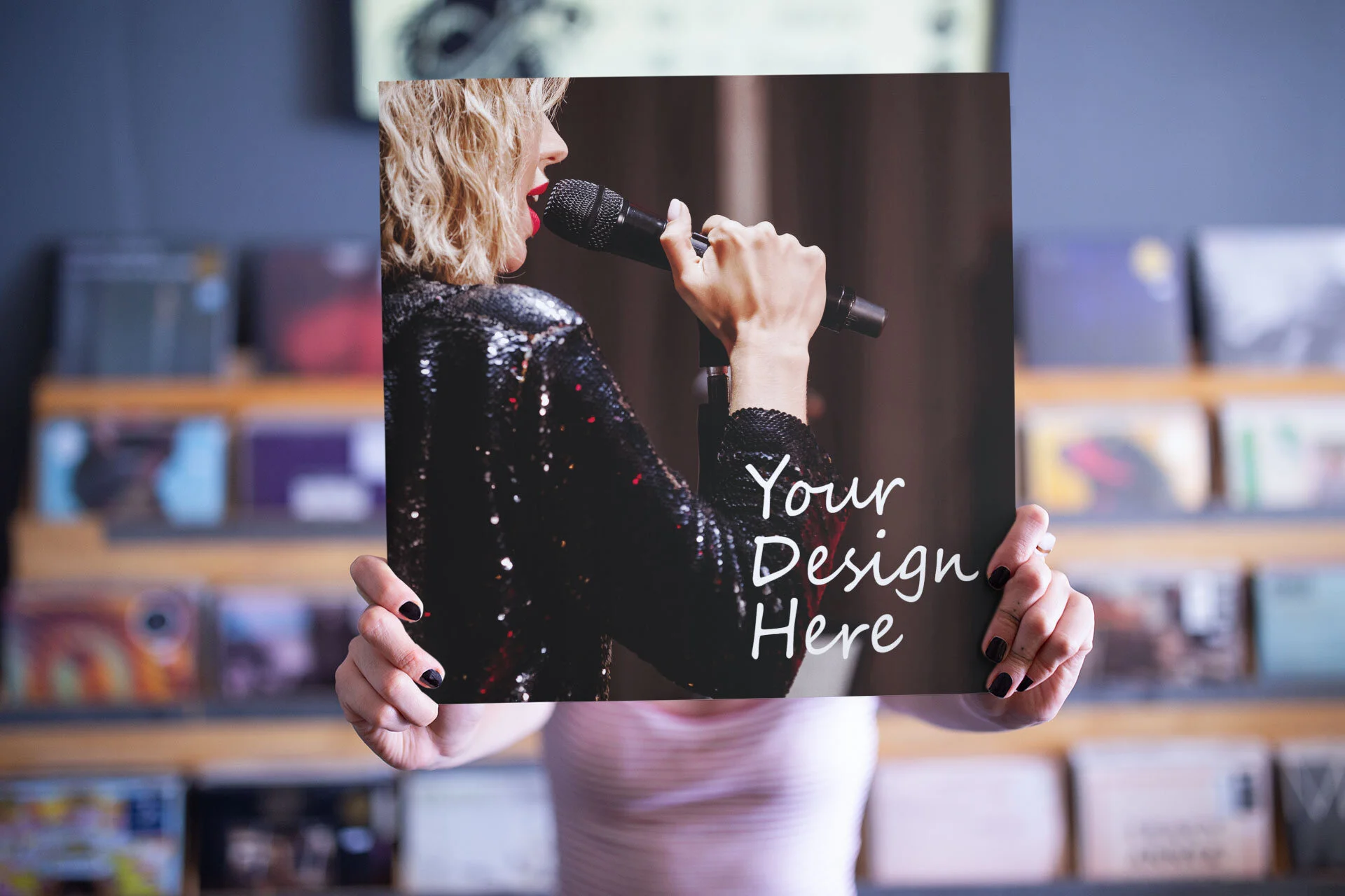 mockup-of-a-girl-holding-a-vinyl-cover-in-front-of-her-face-with-a-blurry-background-22092.jpg