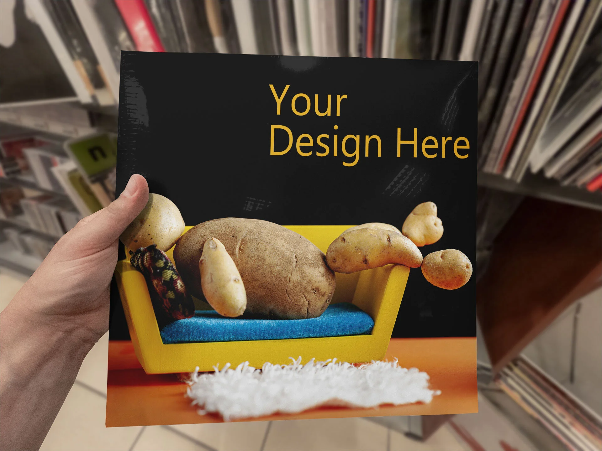 mockup-of-a-man-holding-a-vinyl-cover-at-a-music-store-2411-el1.jpg