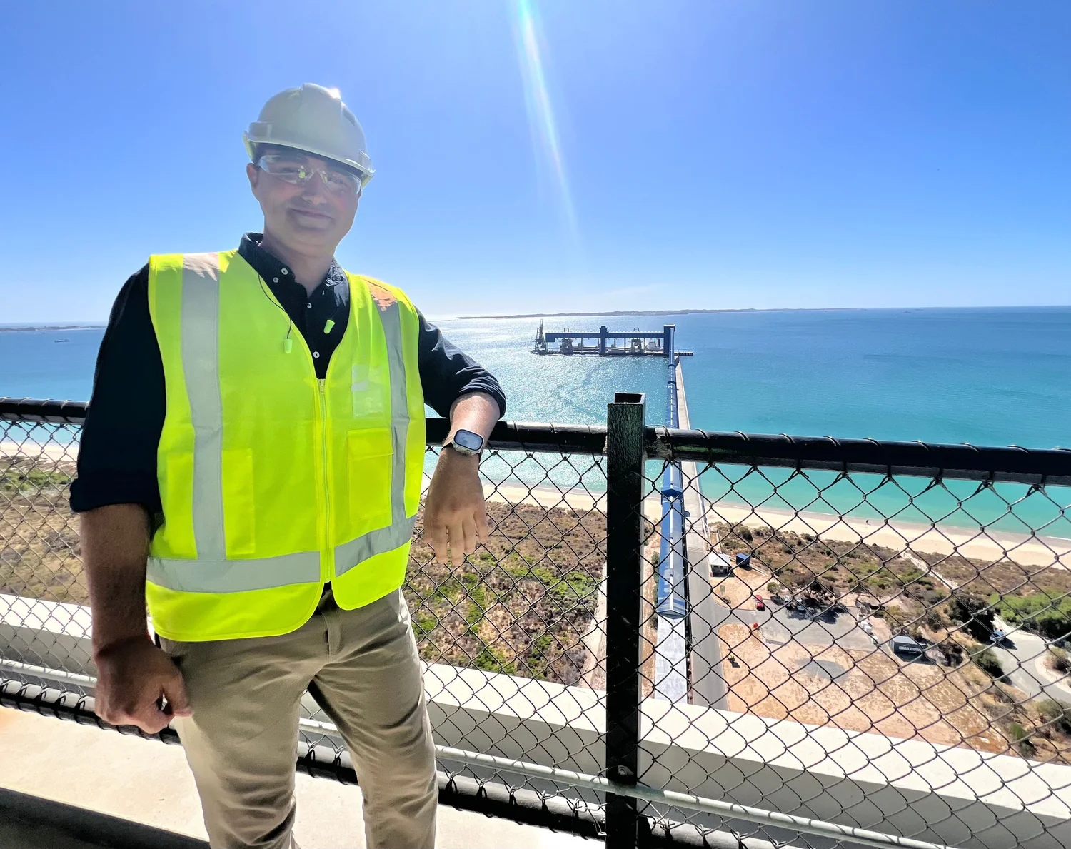 Matthew Kronborg on an industrial site visit in a hard hat and high visibility vest