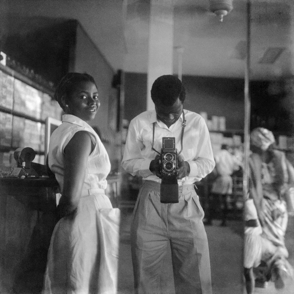  James Barnor’s  Self-Portrait with a Store Assistant at the West African Drug Company, 1952  