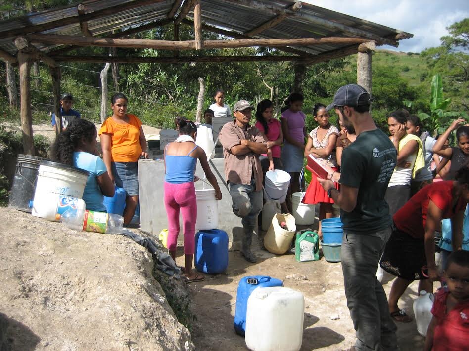 Filling jugs at the new community water station in Carrizalito.