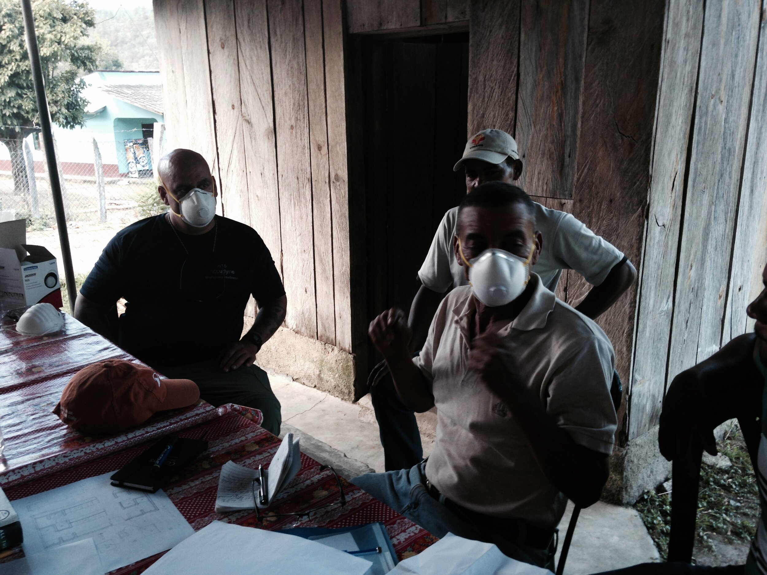 Demonstrating pesticide handling safety equipment.