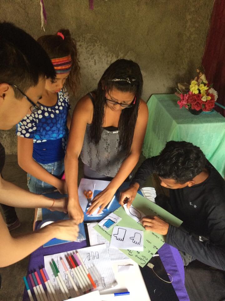 Fuerza students create educational posters on safe pesticide handling.