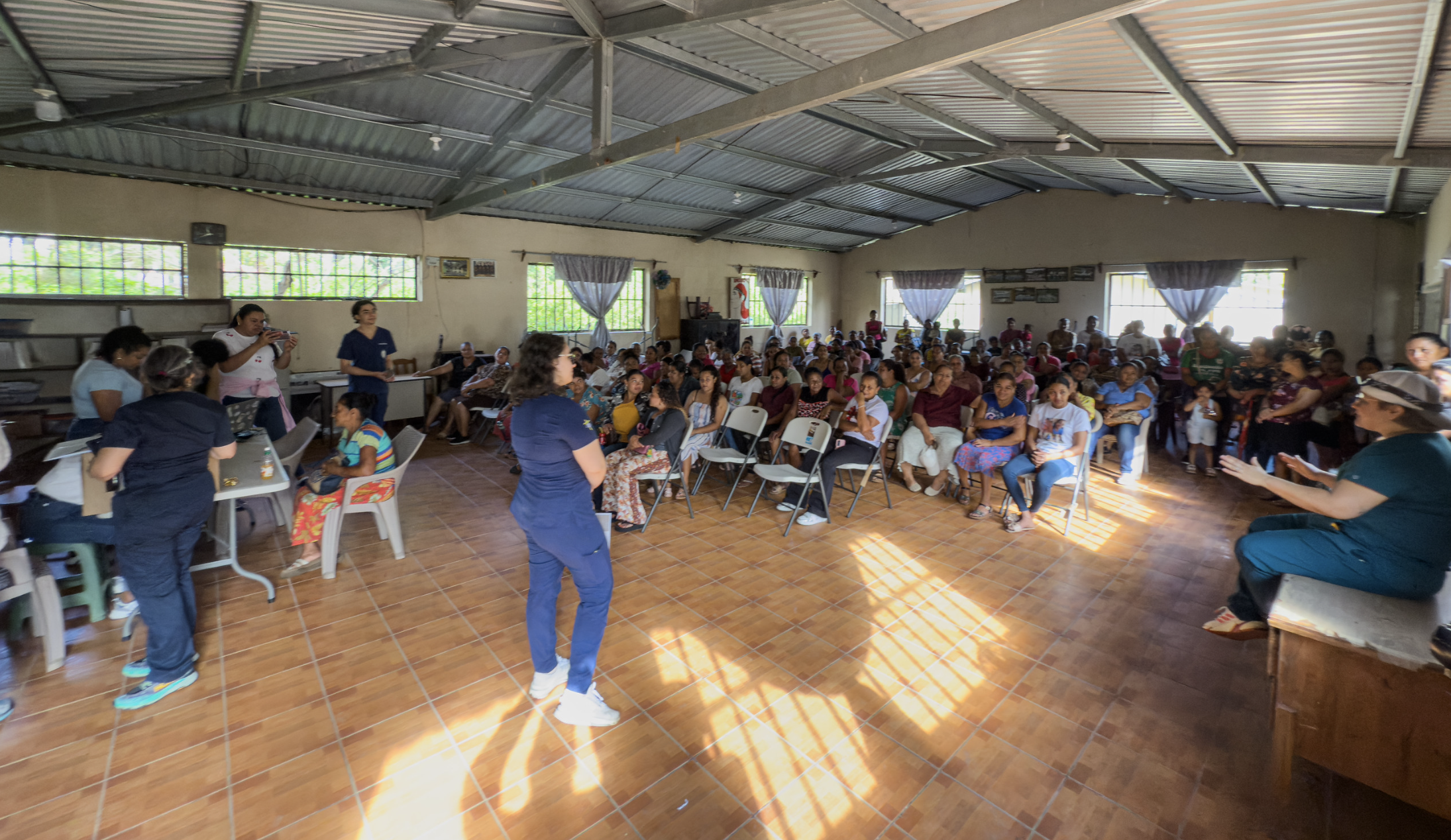 The Honduran PESCA program, led by Suyapa Bejarano MD PhD, has been screening for cancers in our catchment area for 15+ years with many lives saved. Here, they are in blue scrubs giving an introduction to the program to women from more than a dozen c
