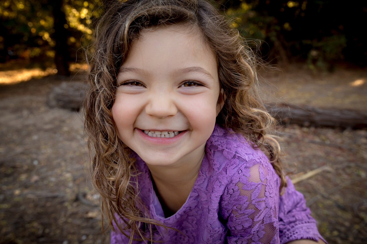 Child-laughing-closeup-purple-girl-Ojai