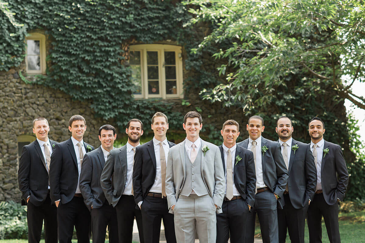 A photo of a groom and his groomsmen