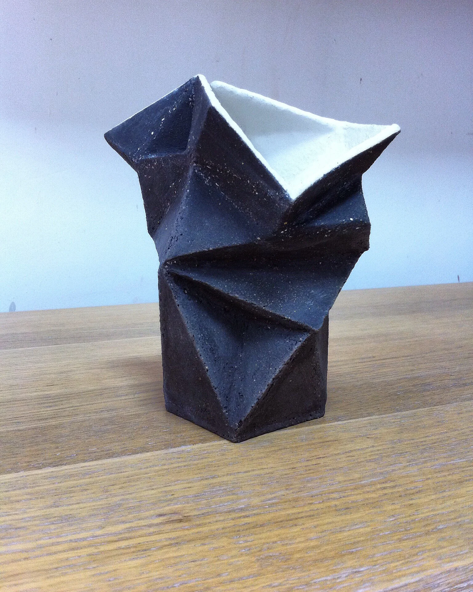 angular black vessel