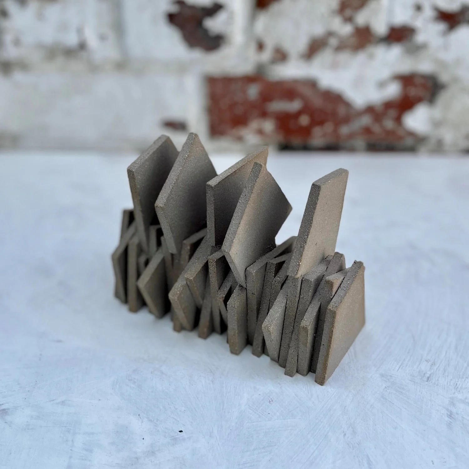 contemporary ceramic art brutalist texture shadow form