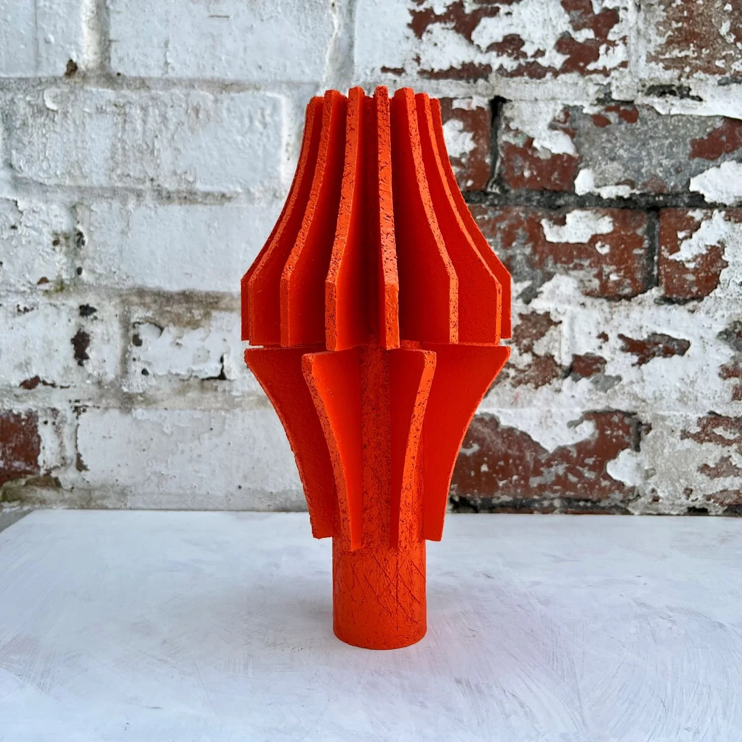 sculptural pottery orange vessel modern interior styling