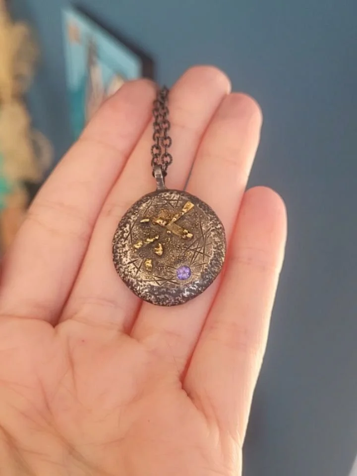 A golden scrapyard galaxy fused atop a melted and fire-forged pile of precious silver after/before thoughts. Remnants of my past creative labor reinvented and reignited by my future daydreams. 
💪⚒️🔥👩&zwj;🏭🌋🆙️👆🪽
Phew! I ordered more silver and