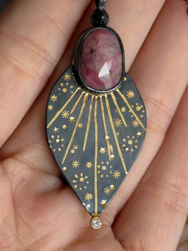 This Big Bang "Star Dial" necklace has the sweetest pale rose cut ruby with tones of silver schiller running through it. I paired it with a sparkly gray spinel to accent the gray tones running through the stone. It's been adopted, but I've 