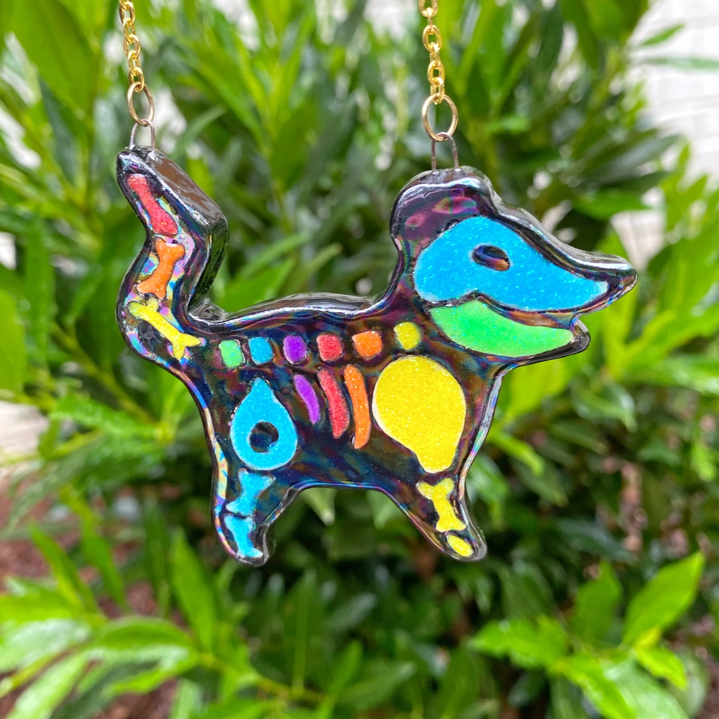 rainbow_possum_skeleton_necklace_1.jpeg