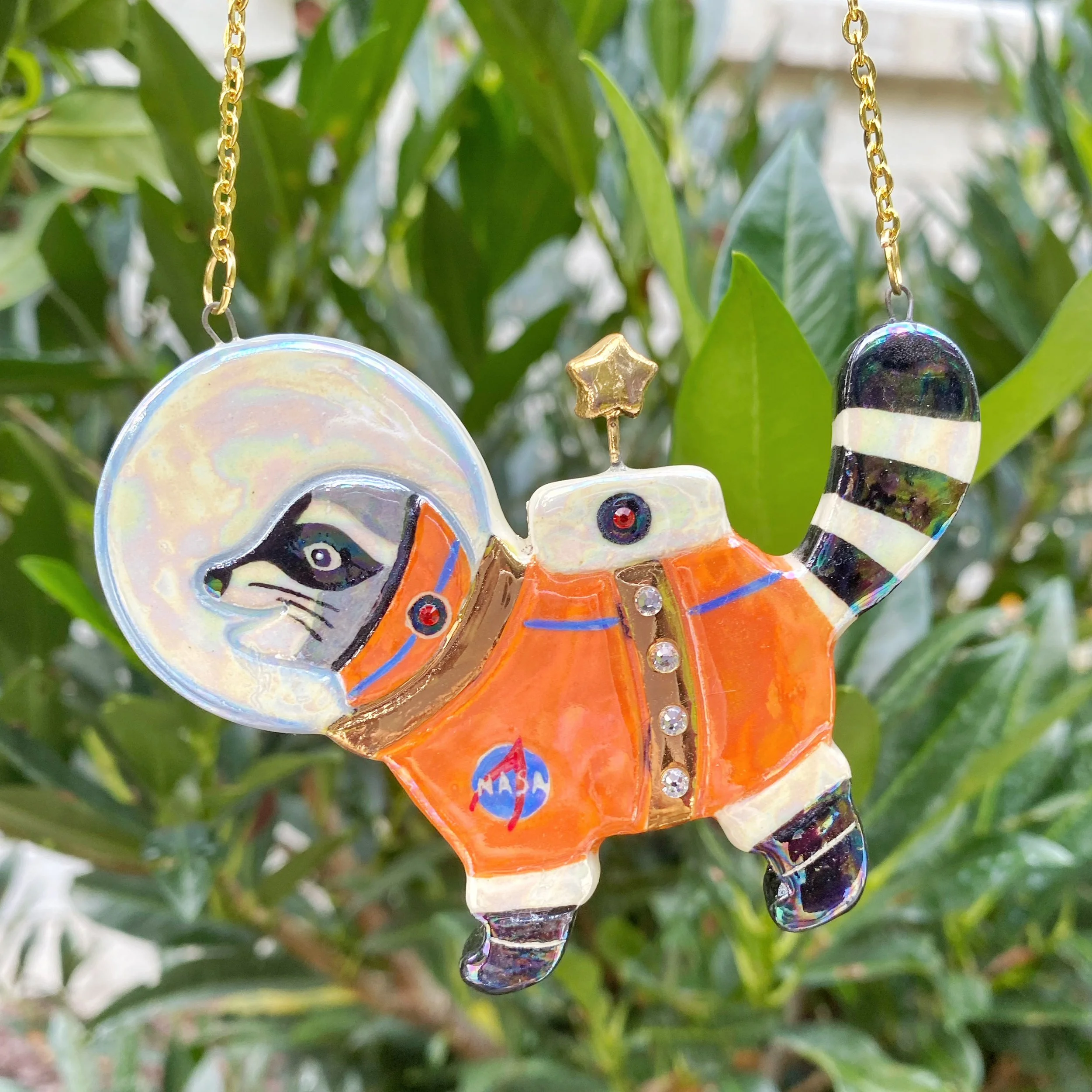 raccoon_astronaut_necklace_gold.jpeg