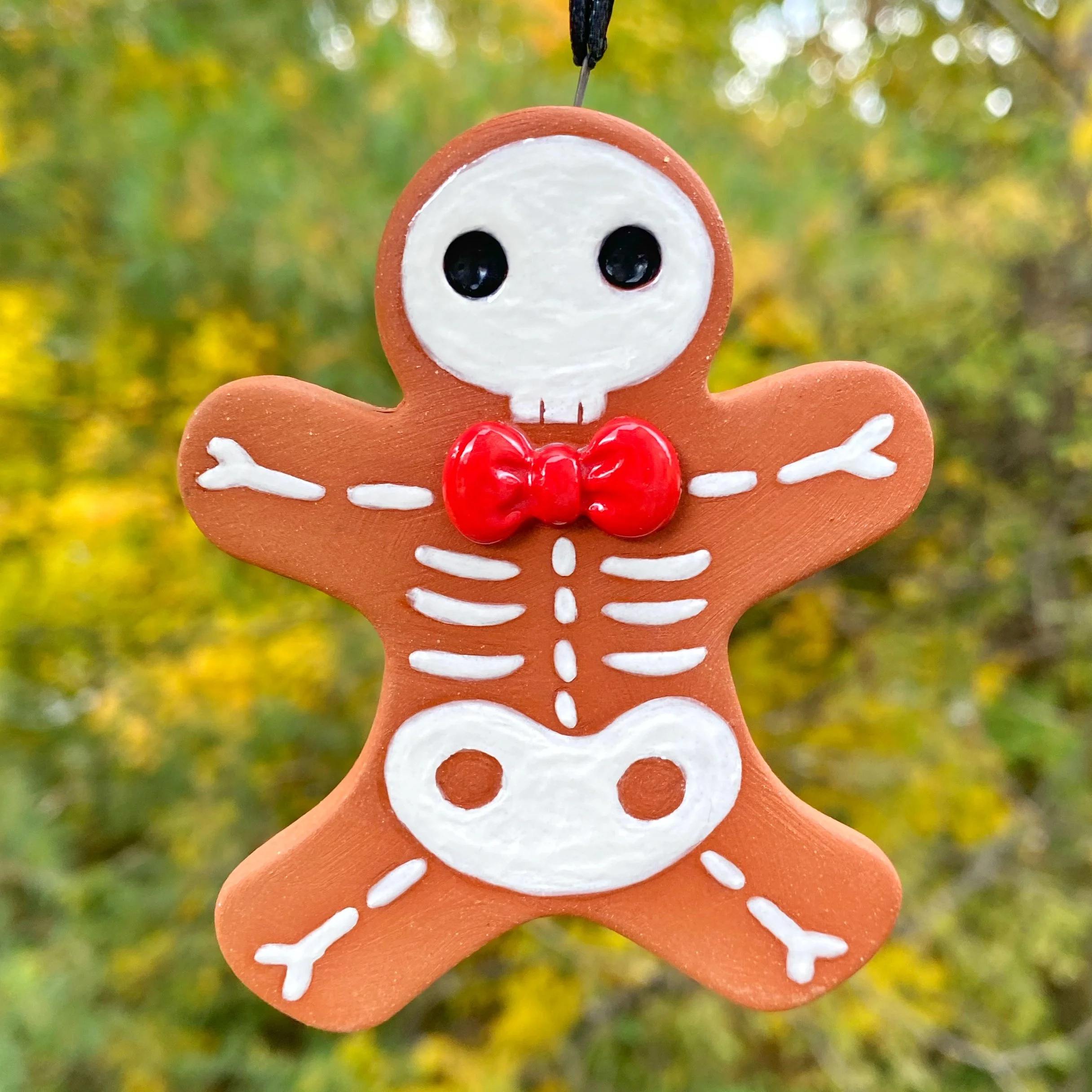 gingerbread_man_skeleton_red_ribbon_1_1.jpg