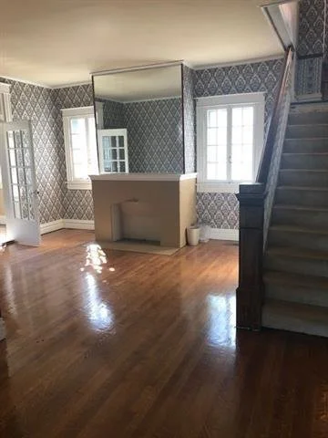 2022 mirror over fireplace.jpeg