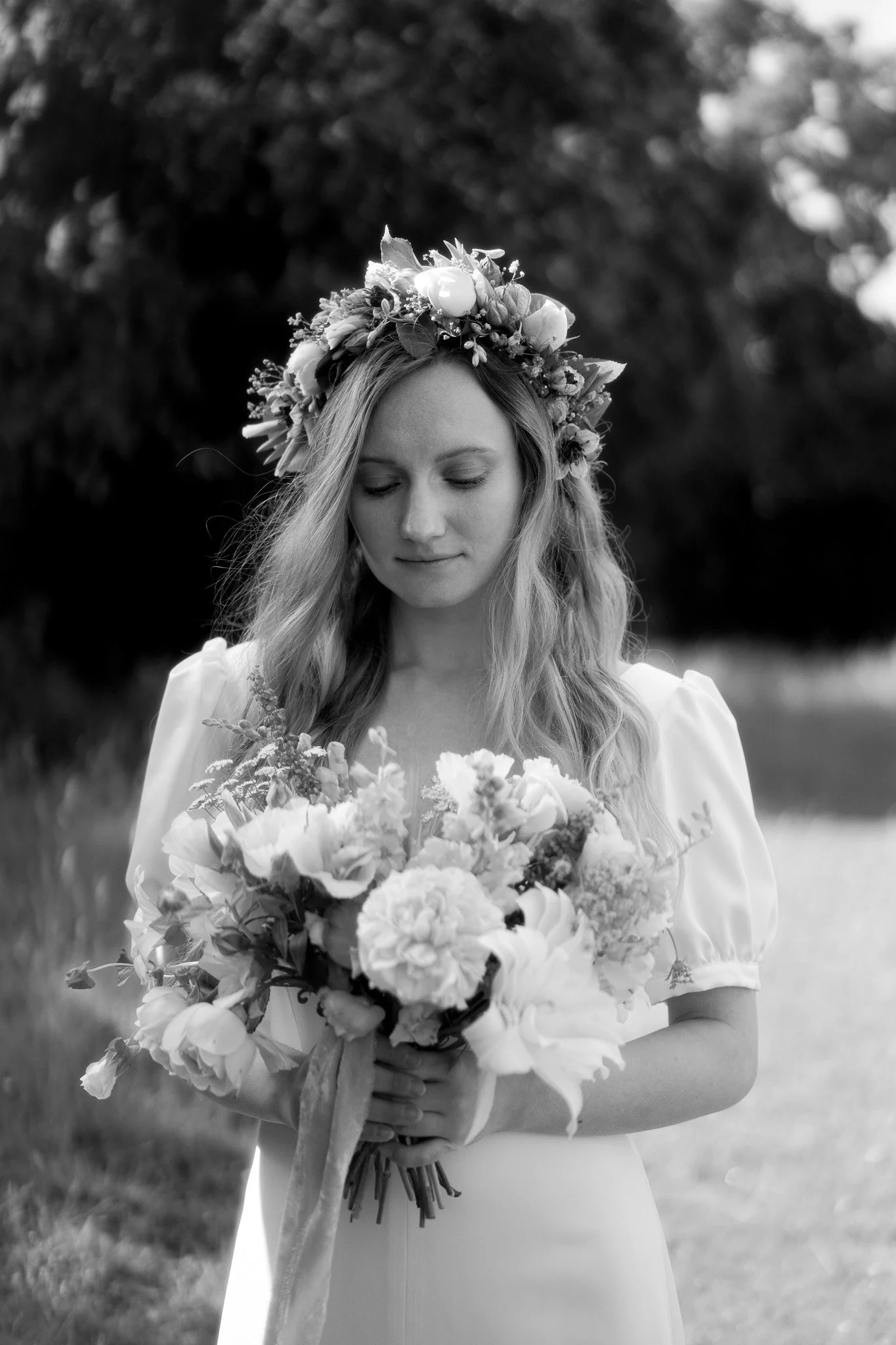 A bride holds her bouquet of flowers on her wedding day