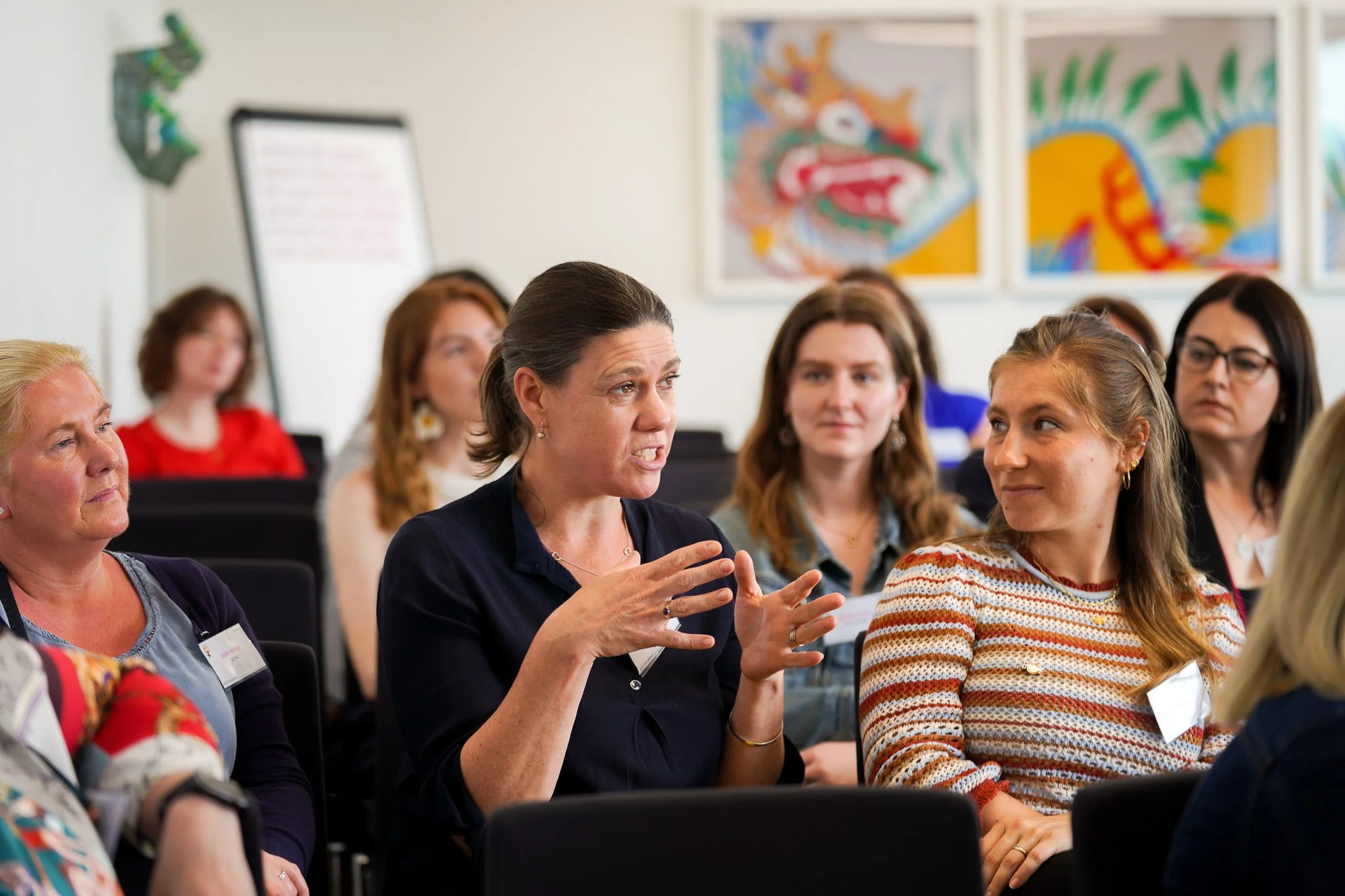 A woman is speaking at a womens networking event in Manchester - photographed by Personal Brand and Portrait Photographer Jodie Thackray Photography