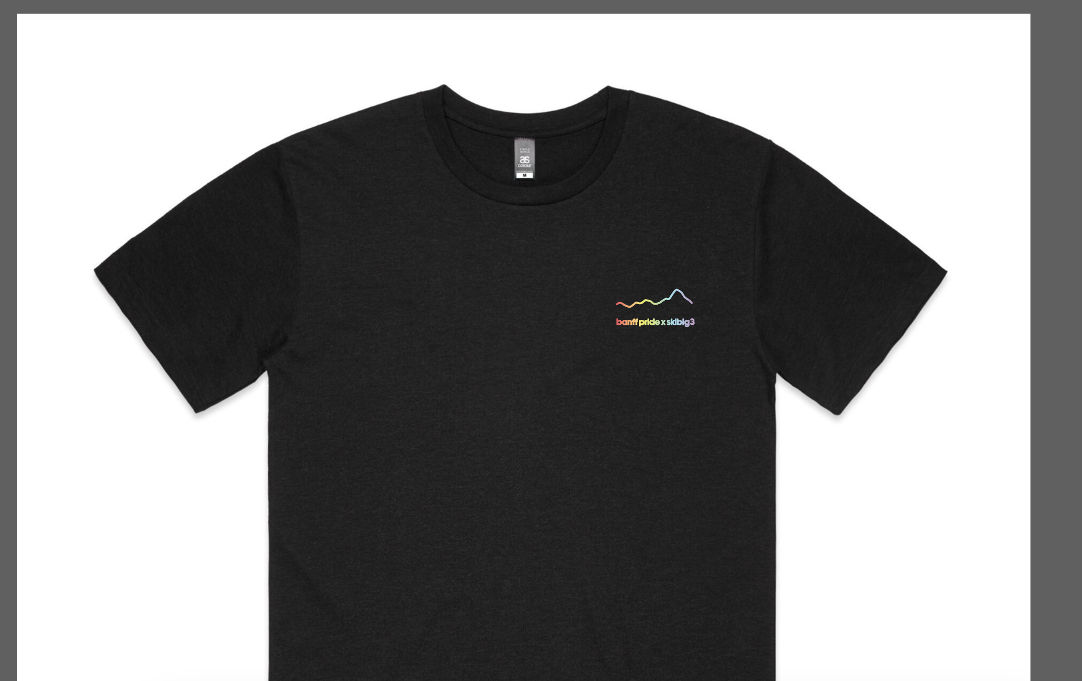 Black Banff Pride x SkiBig3 t-shirt with small rainbow mountain line logo on the left chest.