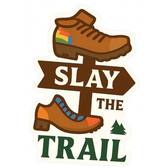 sticker reading “SLAY THE TRAIL” with an illustrated trail signpost and two hiking boots, including rainbow details and a small evergreen tree.