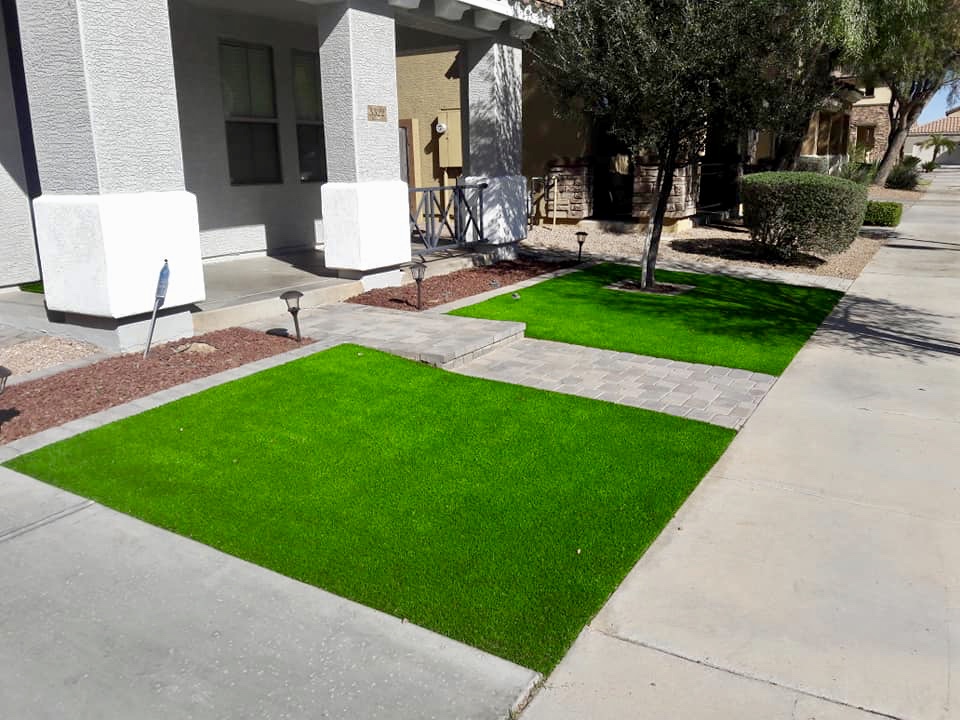 Gorgeous Curb Appeal with custom split yard and center walkway on east valley home front yard with artificial turf fake grass for low maintenance yard