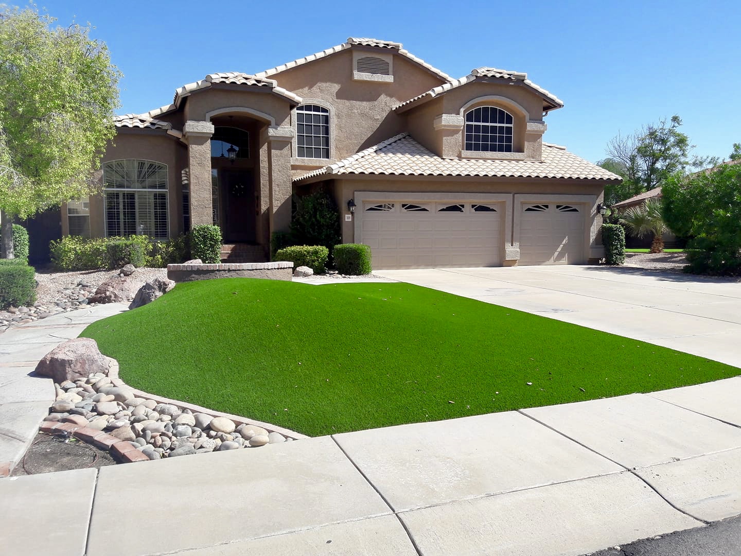 statement front yard with artificial turf fake grass for no watering and low maintenance curb appeal