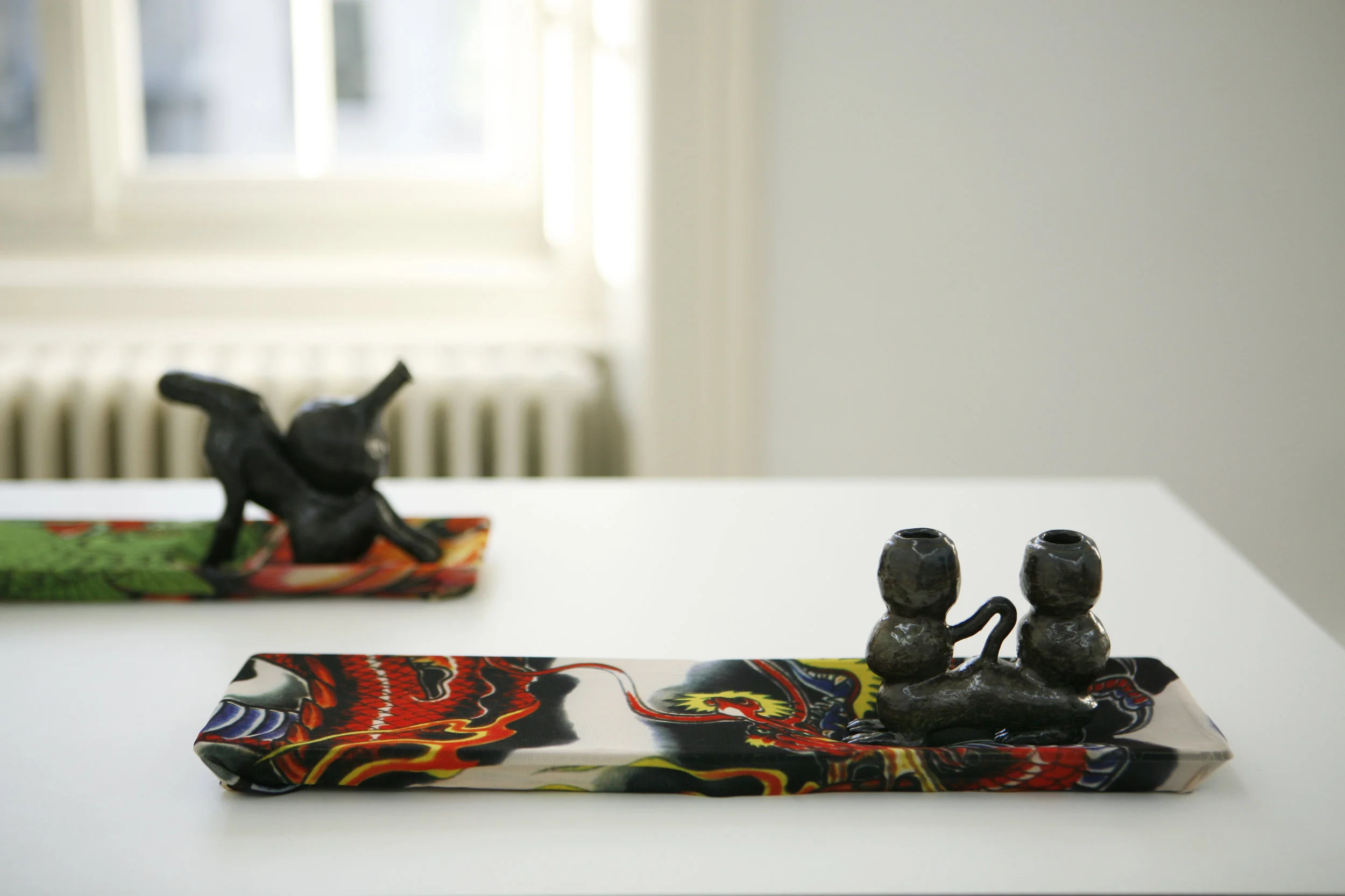  Ridiculous Accuracy In Our Time (part of series), 2016, tattoo arm warmer, ceramic, and plastic sushi box, Exhibition view at Kunsthaus Langenthal, Switzerland 