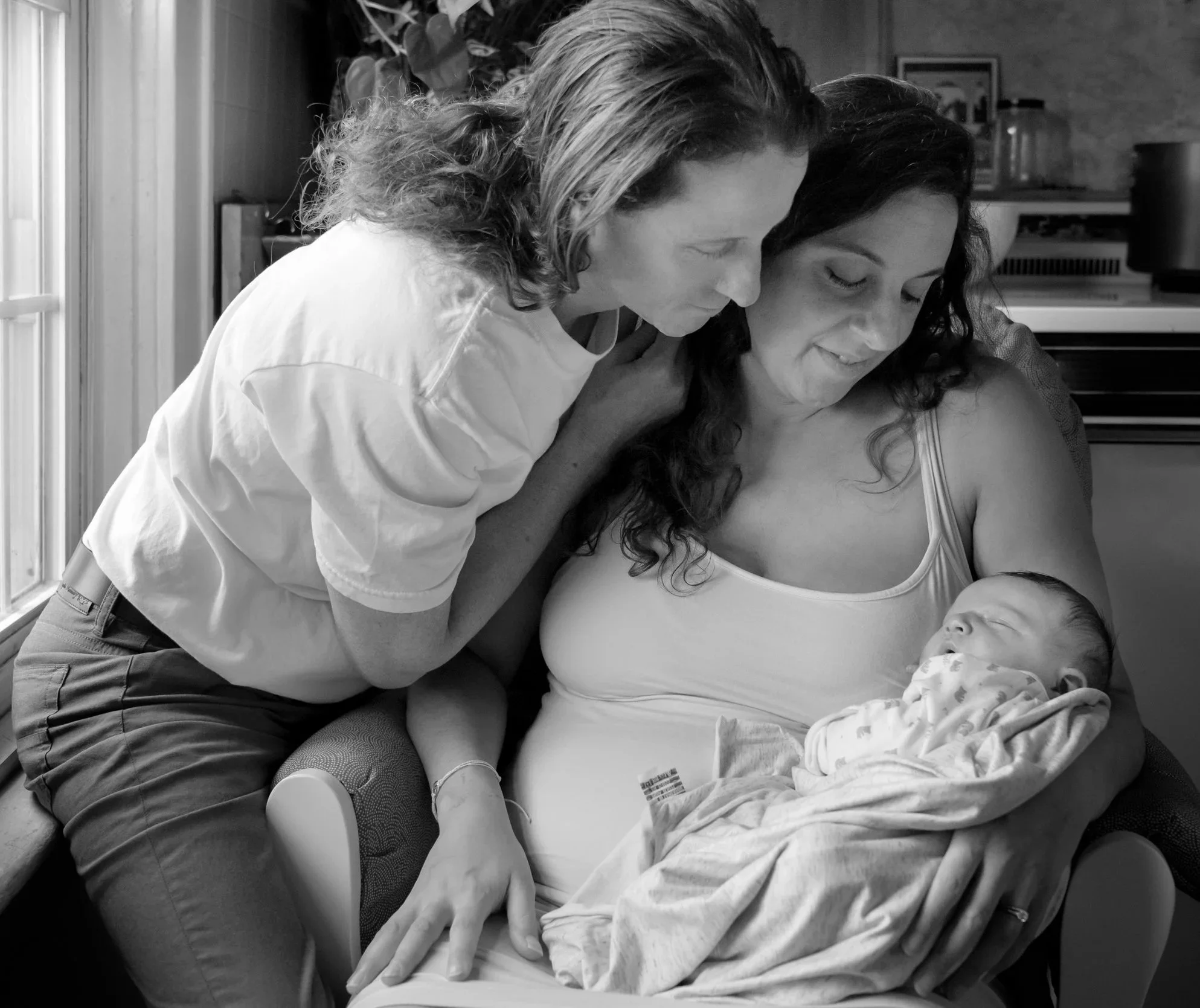 Dr. Sura Corrigan providing postpartum chiropractic care for mothers in Far Hills and Jersey City NJ