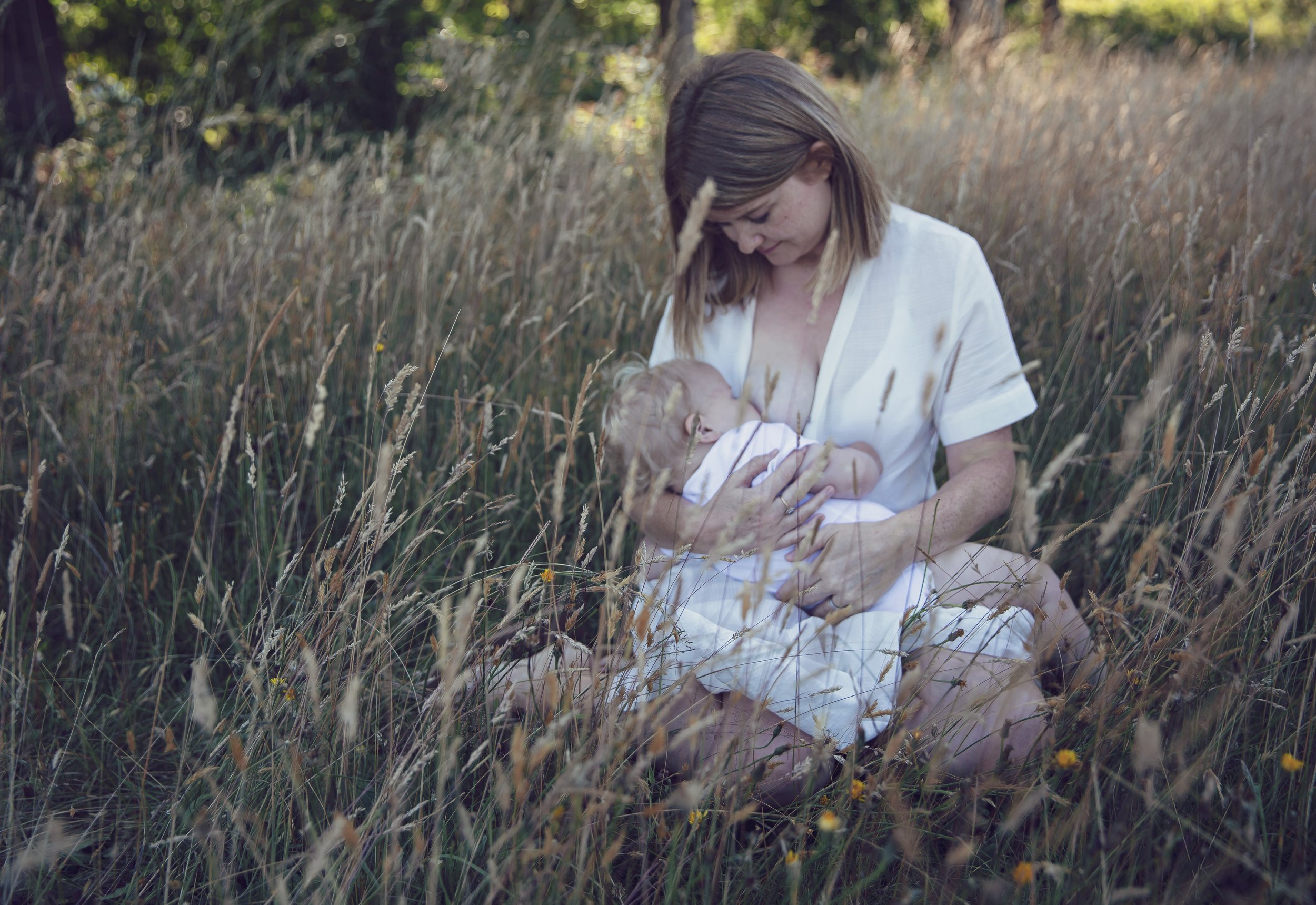 Emotional breastfeeding photography - stunning motherhood portraits 