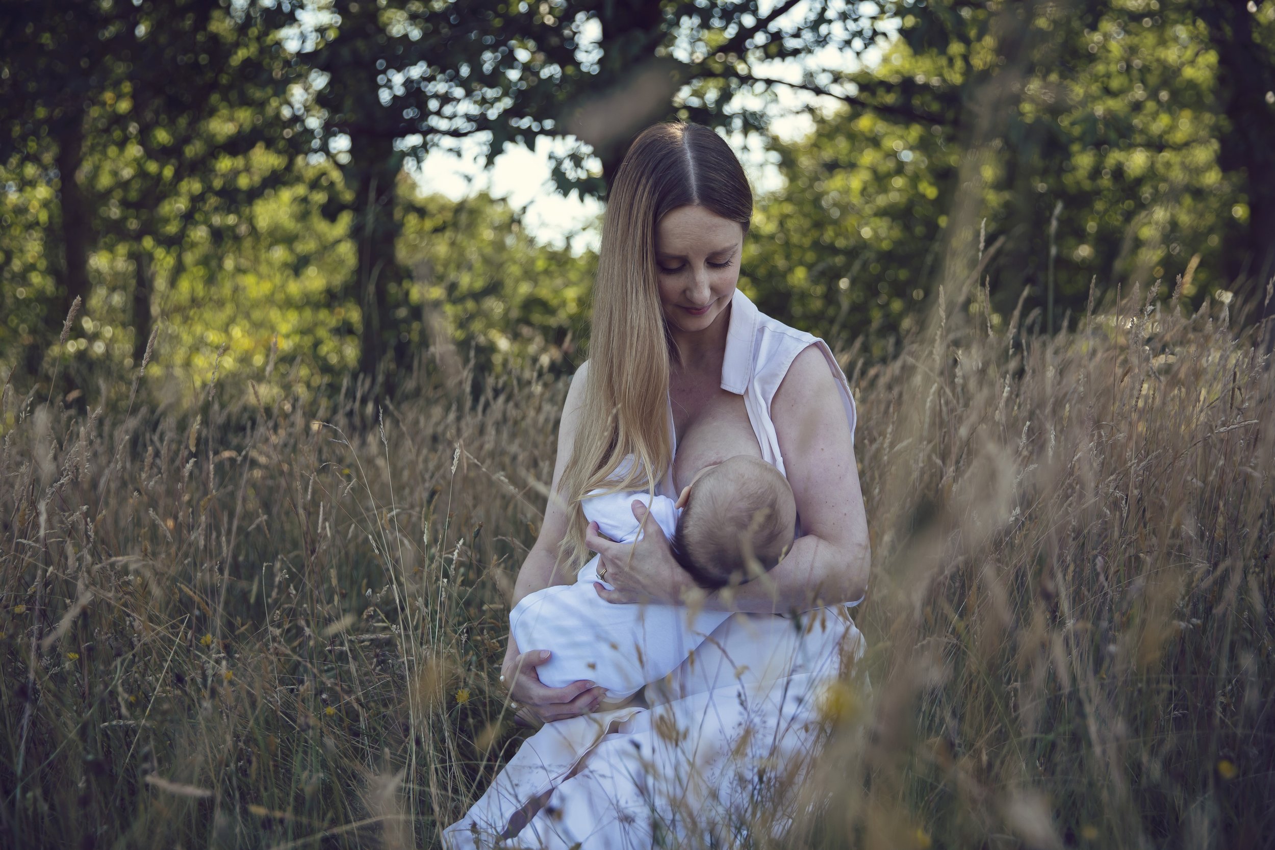 Emotional breastfeeding photography - stunning motherhood portraits 
