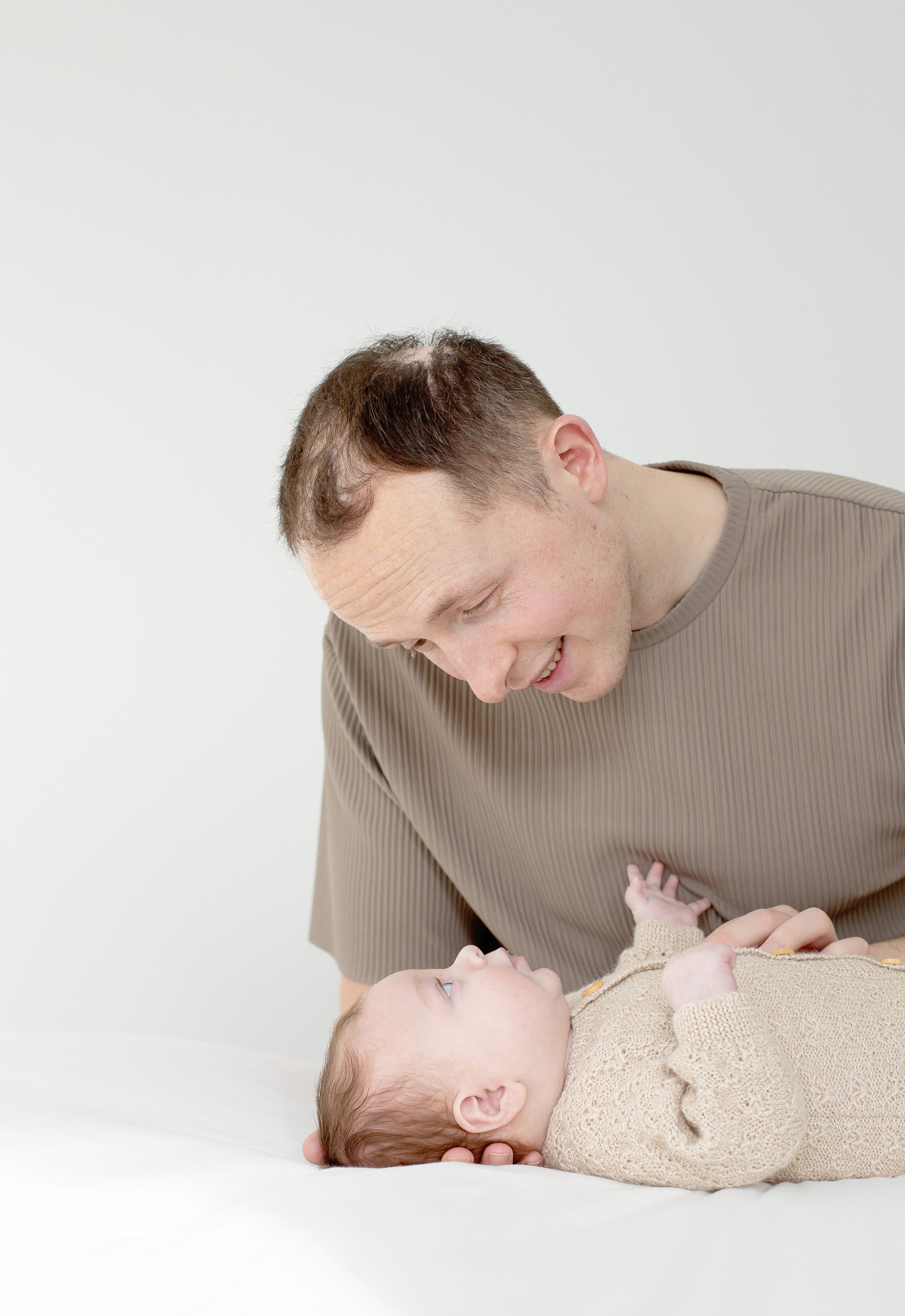 Dad and baby playing together