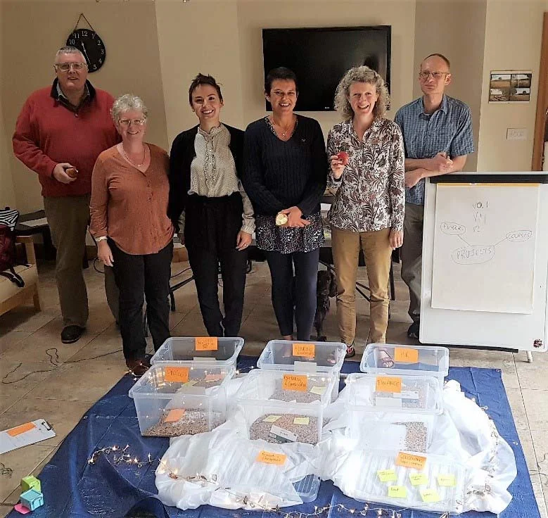 The Cart Shed team. This photo is from our session exploring concepts of cloud storage, security, access and information structure using tarpaulins, fabric, fairy lights, bird seed, string, and storage boxes. Who knew the subject could be such fun? Even the dog joined in.