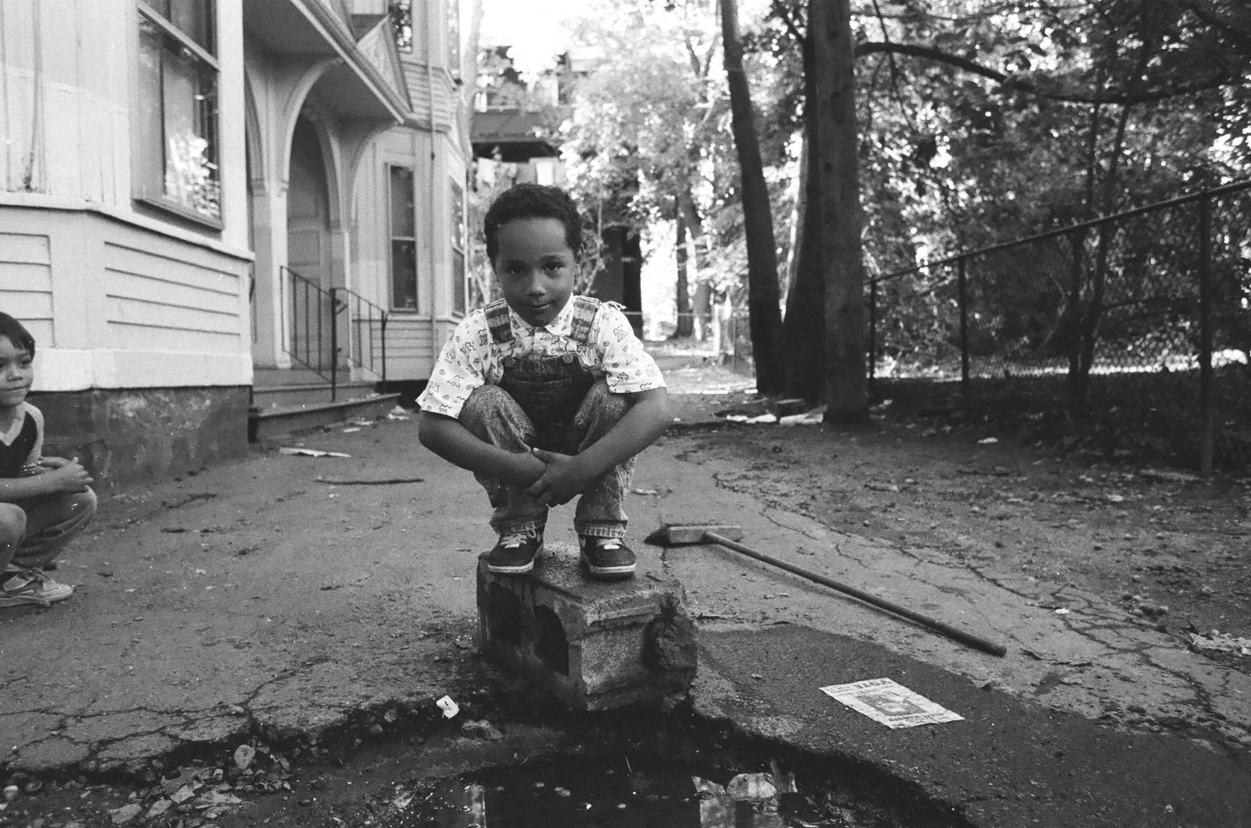 (H)Children of the Projects boy on the brick.jpg