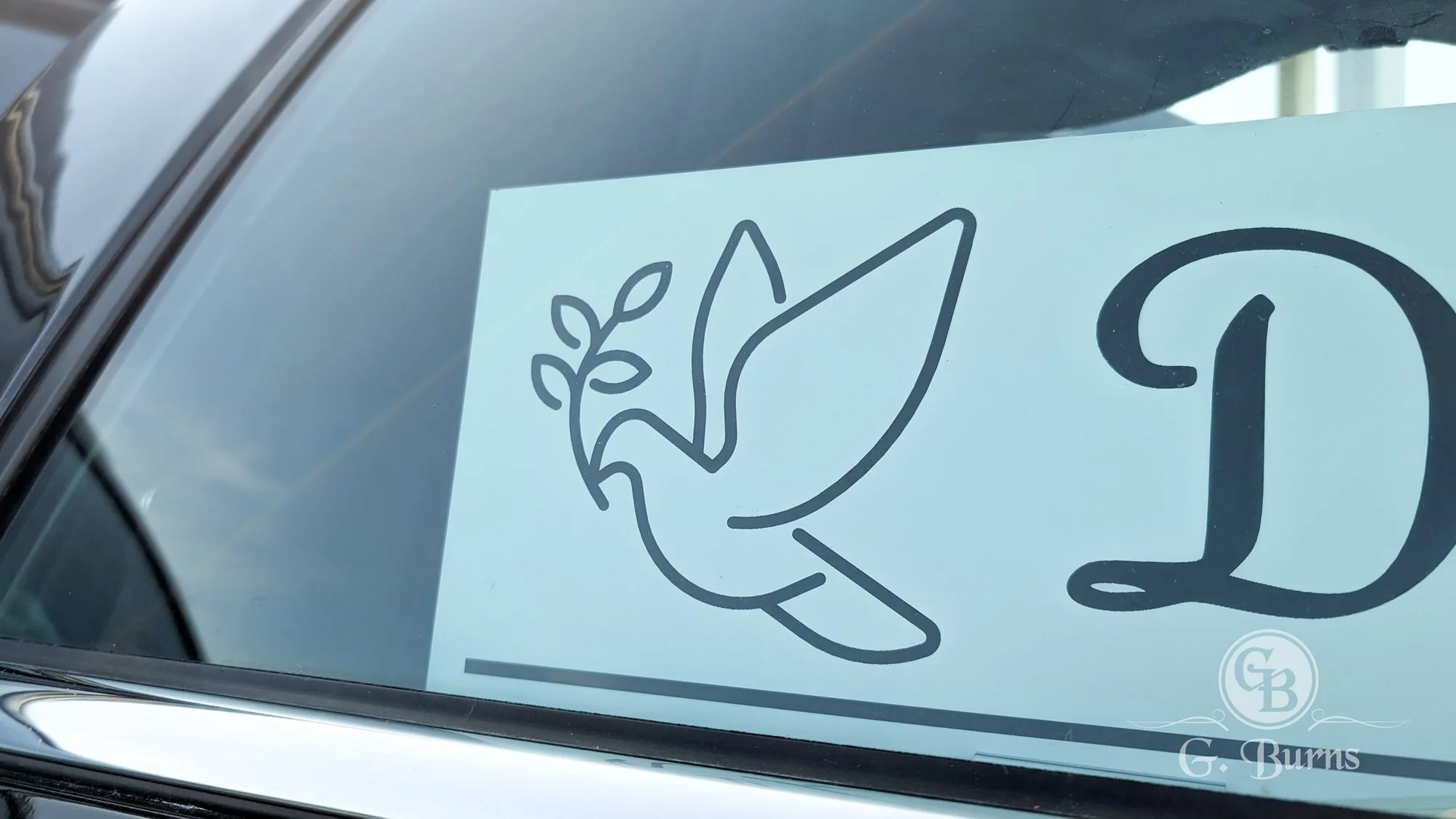 signature-engraved-hearse-nameplate-dove-design-window-detail-gburns.jpg